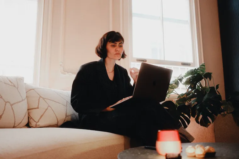 A remote professional working on a laptop from a calm home office